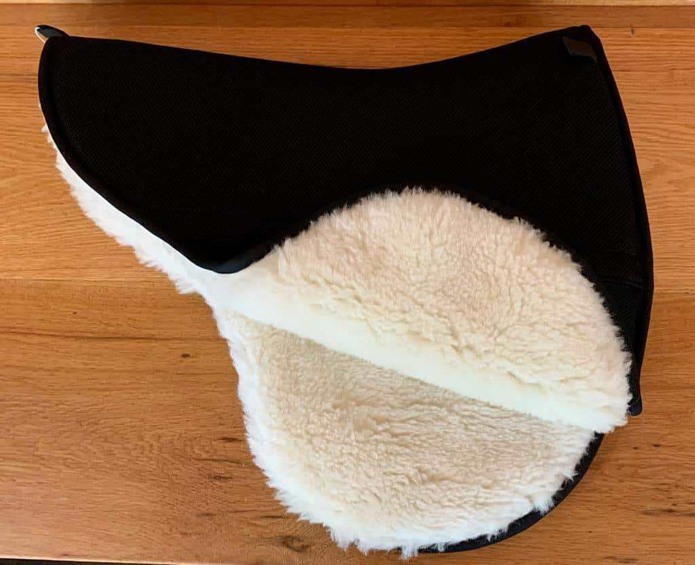 Freeform fleece (wool back) saddle pad for treed or treeless saddles.