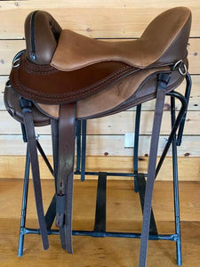 Freeform Pathfinder Treeless Saddle with leathers and carmel brown color seat.