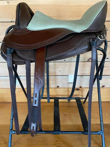 Freeform Pathfinder Treeless Saddle with leathers - mint green seat on a brown saddle base.